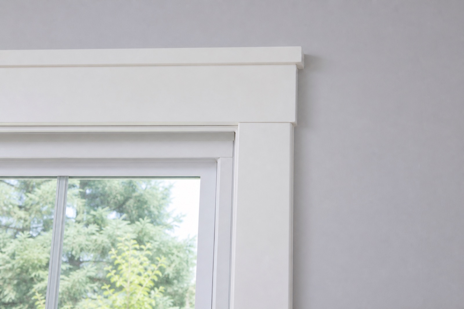 Freshly installed white window trim and casing
